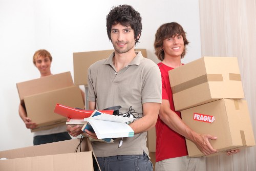 Removal team assisting a home move in Edgware with boxes and furniture