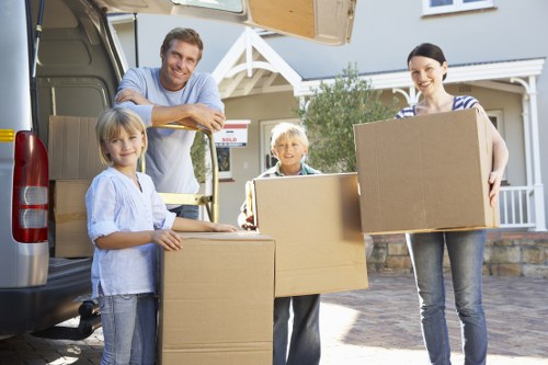 Unloading household items into a new home in Edgware