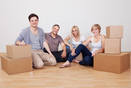 Packed moving boxes and furniture ready for transport in Edgware